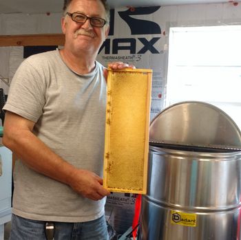 David Shahan holding honeycomb.